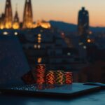 Laptop and poker chips in a Spanish setting