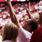 Two Arizona sports betting fans at a basketball game